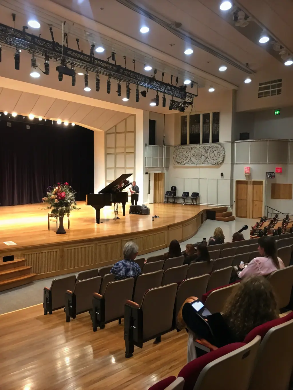 A performance venue with an audience enjoying a show, representing 2117's management of performance spaces.